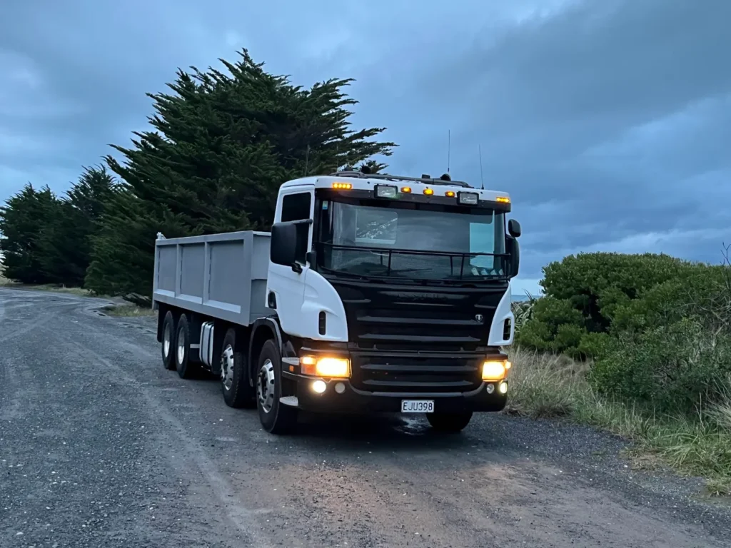 Tipper truck carting material on a rural Canterbury road